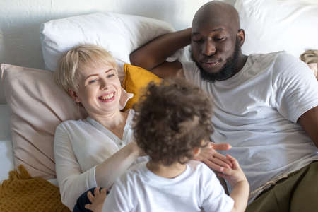 the happy family at home, different nationalitiesの写真素材