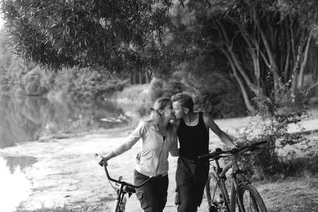 the Couple in love on the beach with bikes, black and white photoの写真素材