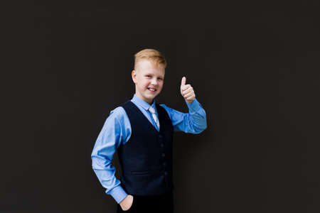 the Happy pupil amid black wall shows classの写真素材