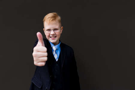 the Happy pupil amid black wall shows classの写真素材