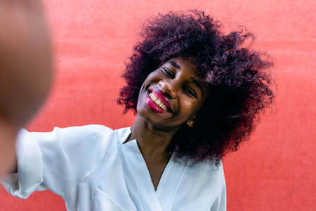 the Happy African American Takes a Selfieの写真素材