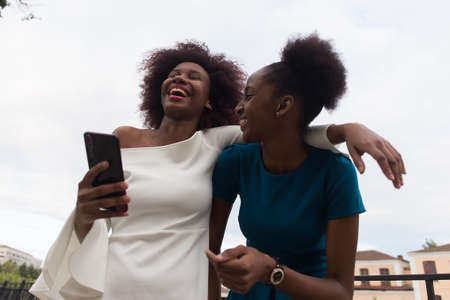 the Happy African American women cuddle, friendsの写真素材