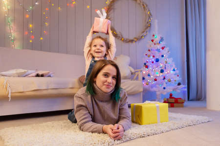 the Happy Mom with Daughter at Christmasの写真素材
