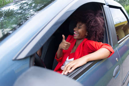 the happy African American passed the exam driving school