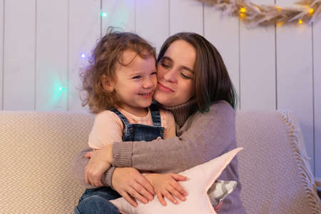 the Mom and daughter have fun at Christmasの写真素材