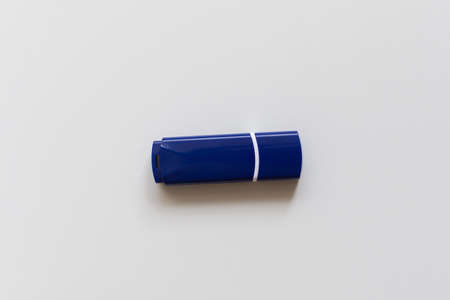 the blue flash drive on a white backgroundの写真素材