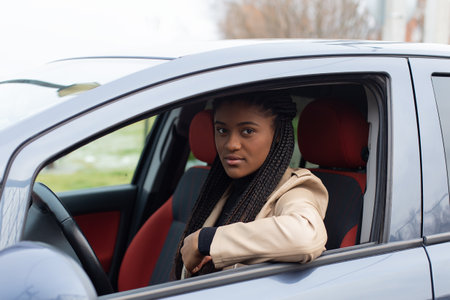 the Serious girl in a car, African-American