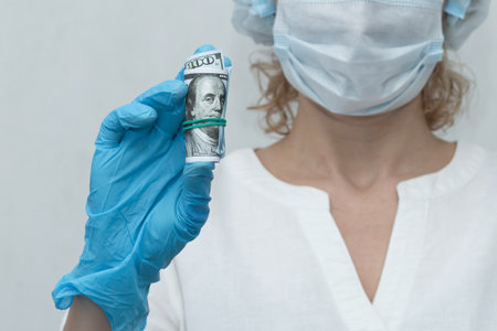 nurse holds dollars and ampoule, vaccinated