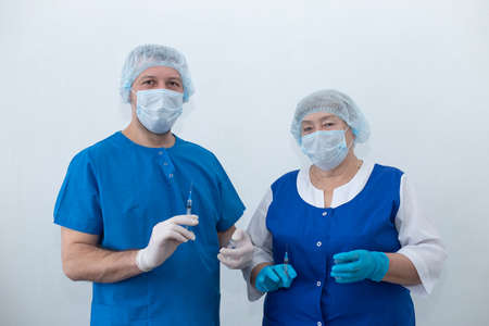 an old nurse and the nurse, a vaccinationの写真素材