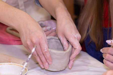 the clay workshop girl working with clay