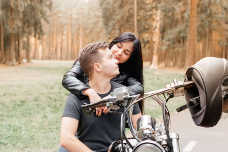guy with a girl in the park on motorcycleの写真素材