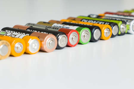 Ivanovo, Russia May 25, 2021, Lots of colorful AA and AAA batteries on a white background, close-up.