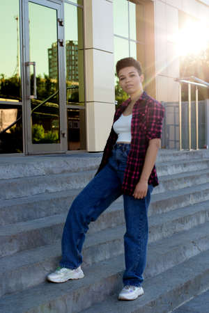 beautiful African American woman with short hair in the summer on the street.の写真素材