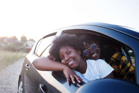 happy african american woman in a car, lifestyle.の写真素材