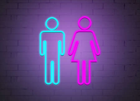 neon signs of men and women on the background of a brick wall.の写真素材