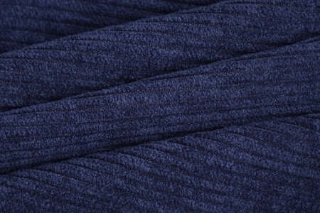 texture of blue corduroy fabric, ribbed.