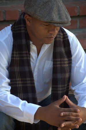 Black man sitting on the stairsの写真素材