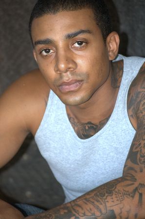 Tough black man with tattoosの写真素材