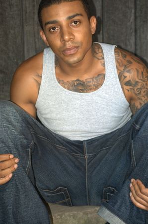 Portrait of a young black man with tattoosの写真素材