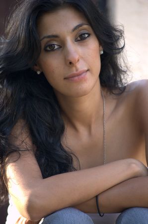 Middle eastern woman sitting downの写真素材