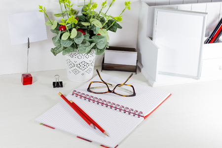 Workplace in white color scheme with elements of redの写真素材