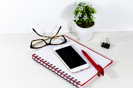 Workplace in white color scheme with elements of redの写真素材