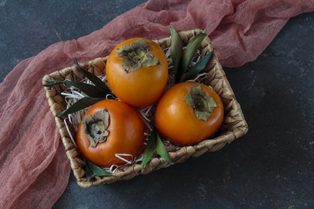 persimmon in the basketの写真素材