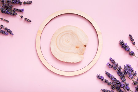 Podium, stage or pedestal with lavender flowers top view. Mockup for cosmetic products.の写真素材