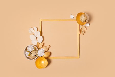 Frame with copy space and Easter eggs composition decorated with twigs and flowers. Easter flat lay...