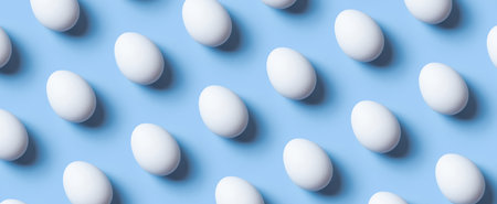 Creative banner with pattern from white eggs on blue background. Easter minimalistic concept.の写真素材