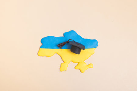 Plasticine map of Ukraine with a graduate hat. Education in Ukraine concept.の写真素材