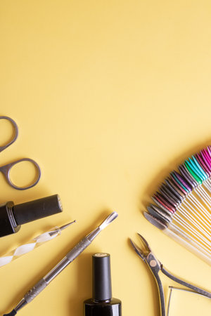 Flat lay manicure tools on a colored background with copy space top viewの写真素材