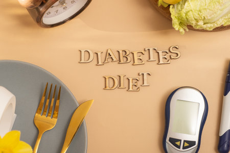 Diabetes die text with plate and cutlery, glucose meter on beige background flat lay, top view.の写真素材
