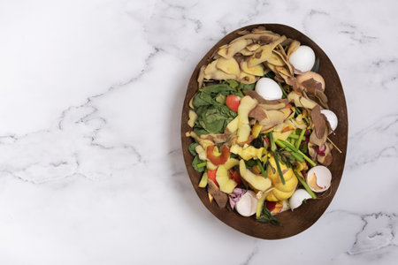 Organic garbage for compost on a marble background. Composting concept flat lay, top view.の写真素材