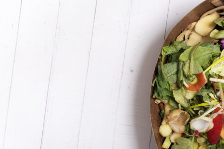 Organic garbage for compost on a wooden background with copy space. Composting concept flat lay, top...