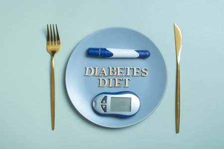 Diabetes Diet text. Glucometer and fork in plate on colored background flat lay, top view. Diet for Diabetics Minimal concept.の写真素材