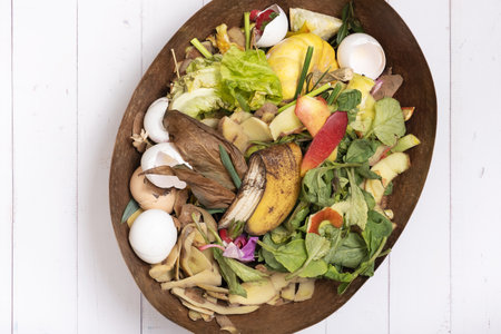 Organic garbage for compost on a wooden background. Composting concept flat lay, top view.