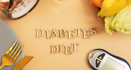 Diabetes die text with plate and cutlery, glucose meter on beige background flat lay, top view.の写真素材