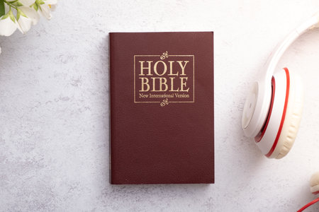 Top View of Holy Bible on working table with headphones. Bible study online concept.の写真素材