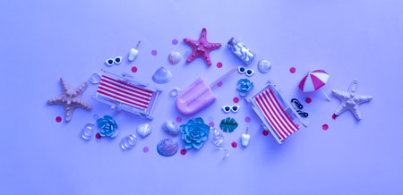Accessories for beach holidays - deck chairs, umbrellas, ice cream top view. Beach party concept in neon light.の写真素材