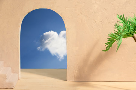 Paper palm tree on the background of concrete wall with arch and blue sky view and stairs. Abstract interior summer background or scene for the product.の写真素材