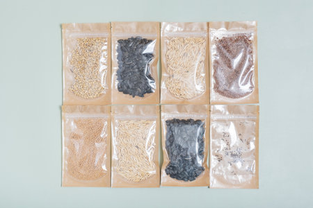 Set for growing sprouts from seeds. Sunflower, flax, wheat seeds lay flat, top view.の写真素材