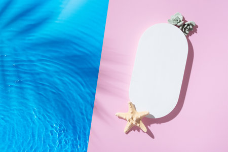 Mock up podium or pedestal flat lay with blue water waves. Hot summer scene for your product top view.の写真素材