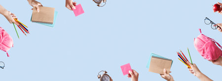 Banner with school stationary in female hands on blue color background with copy space. Back to...