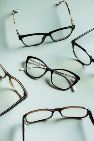Stylish eyeglasses on colored background. Optical store, vision test, stylish glasses concept