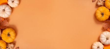 Autumn banner with flat lay composition from pumpkins and fallen leaves and sweater with space for text.の写真素材