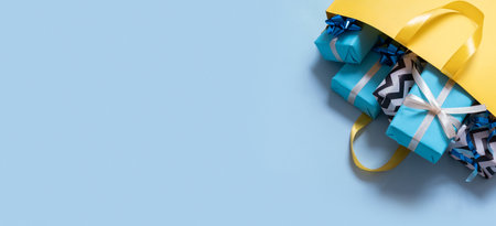 Many gifts for the holidays concept. Holiday shopping concept on a color background.の写真素材