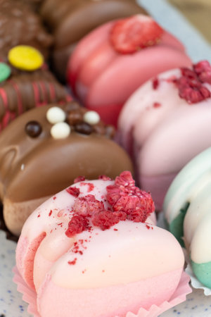 Colored macaroons with decoration for those with a sweet tooth close up