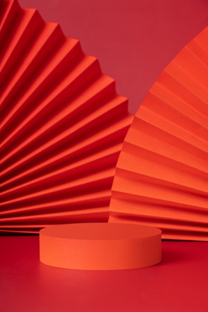 Mock up podium stage or pedestal with fans background. Monochrome red. Decorations to Chineese New Year for your products.の写真素材
