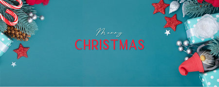 Merry Christmas greeting banner with flat lay winter holidays decorations on turquoise background